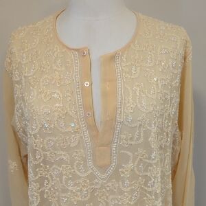 A Sher light gold colored tunic)topand cream Embroidered T